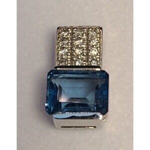 14 K White Gold Blue Topaz 3.9ct With 12 Round Diamonds Pendant .685" Long